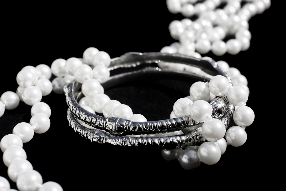 pearl necklace on black background