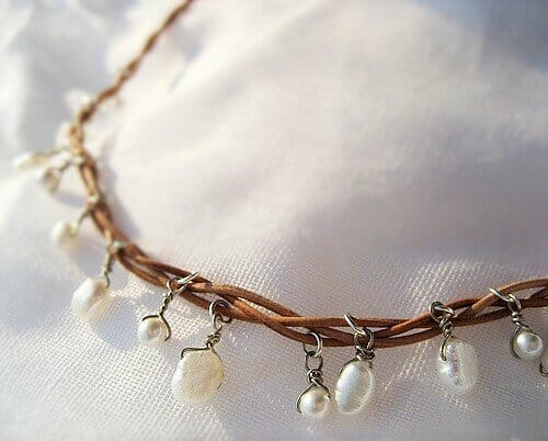 white pearls on leather string